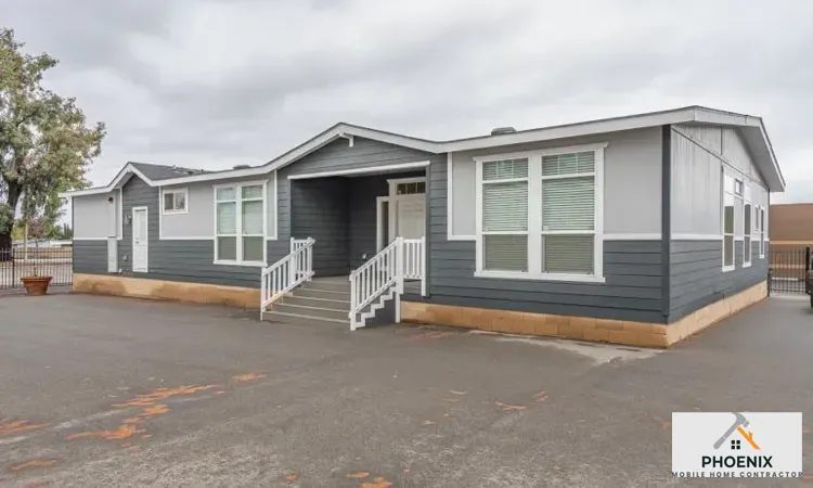 Double Mobile Home Price in Arizona Double-wide manufactured home with new skirting and foundation setup in Mesa, Arizona
