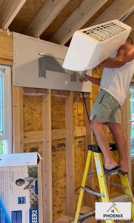 Mobile Home HVAC and Ductwork Services Contractor mounting ductless mini-split AC unit in mobile home for energy-efficient cooling
