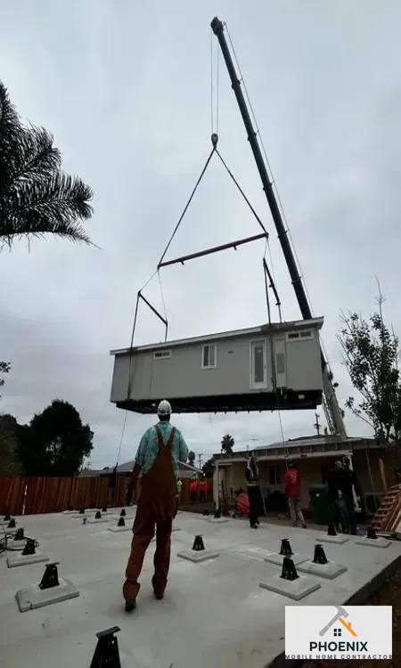 Mobile Home Installation Service in Phoenix Crane lifting and installing new manufactured home on prepared foundation in Mesa, Arizona