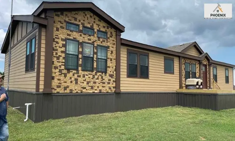 Upgraded double-wide mobile home with premium skirting and stone accent siding in Phoenix, Arizona
